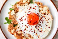 Crispy Feta Skillet Eggs with Olive and Herb Crunch