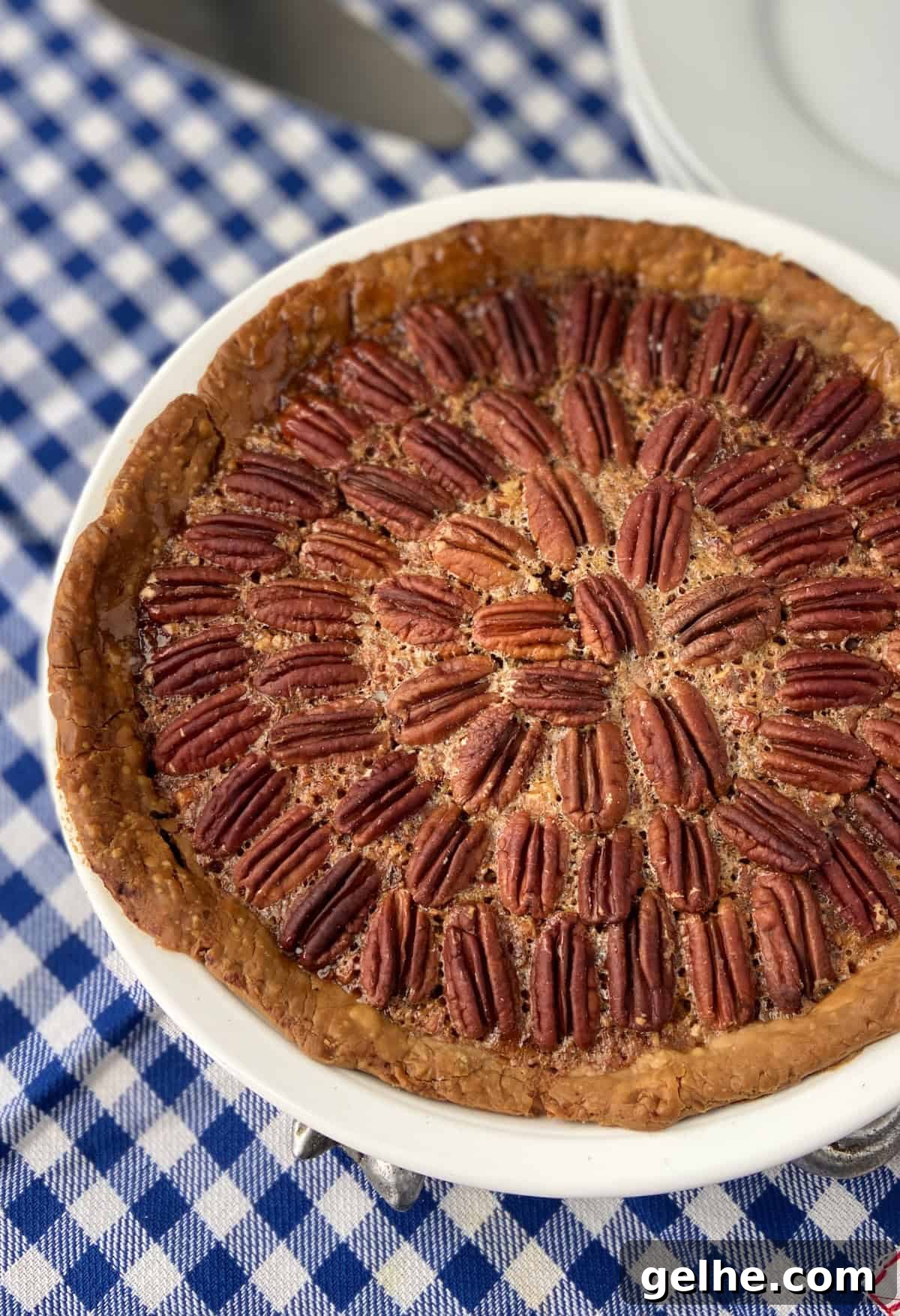 Classic Southern Pecan Pie Recipe: Authentic, Easy-to-Follow Instructions 2 Pecan Pie in white pie dish.