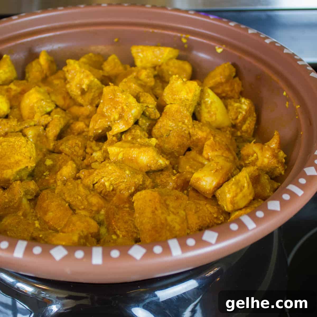 Mediterranean Chicken Tagine with Black Olives and Preserved Lemon 3 Browning the chicken and seasoning in a skillet.