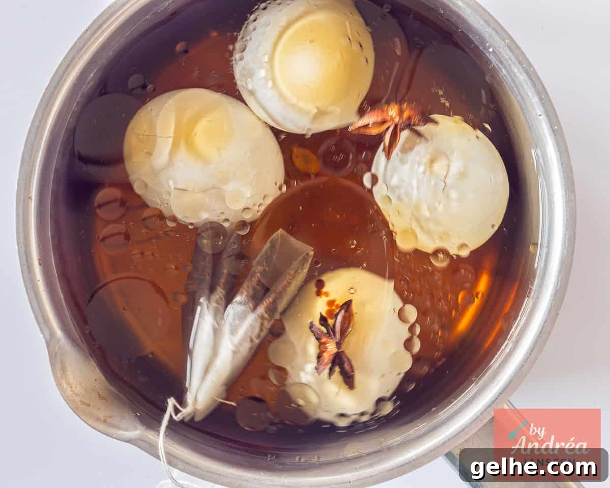 How to Make Chinese Tea Eggs: Savory Marble Egg Recipe 6 Eggs are marinating in flavorful liquid