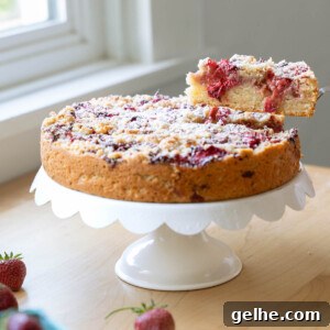 A slice being removed from a balsamic strawberry cake