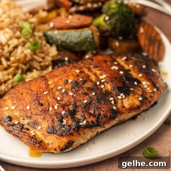 Grilled salmon, grilled vegetables and rice on a plate