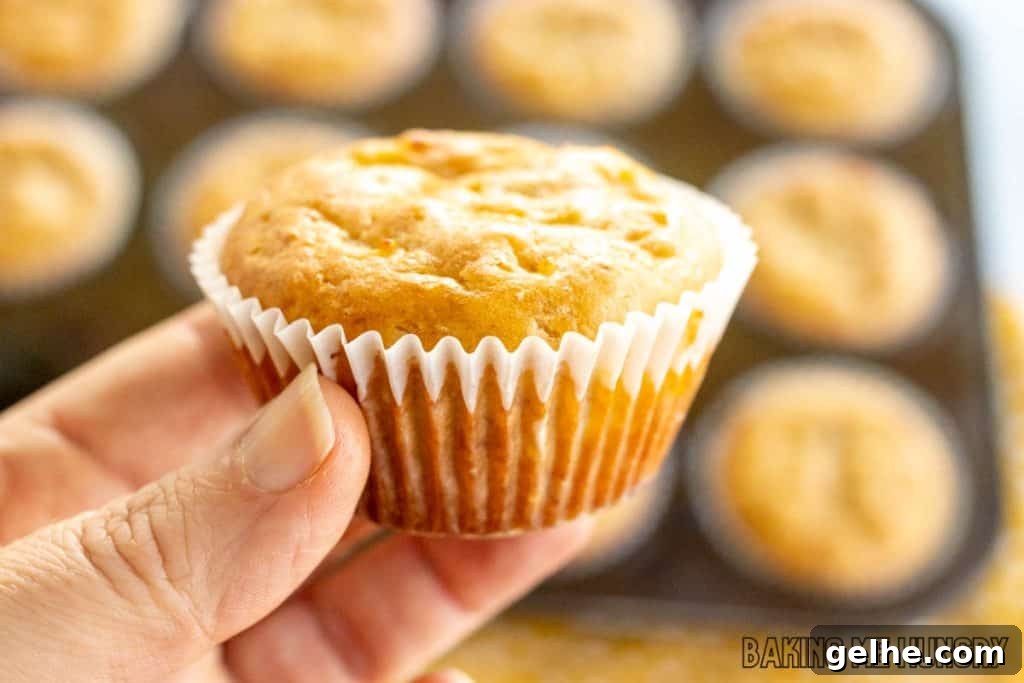 Banana and Cottage Cheese Muffins with Moist Texture 11 hand holding a cottage cheese banana muffin