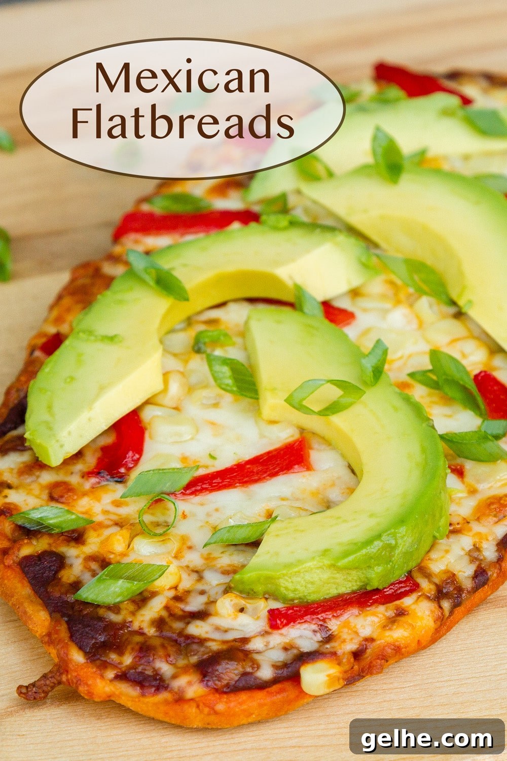 a Mexican flatbread on a wooden cutting board.