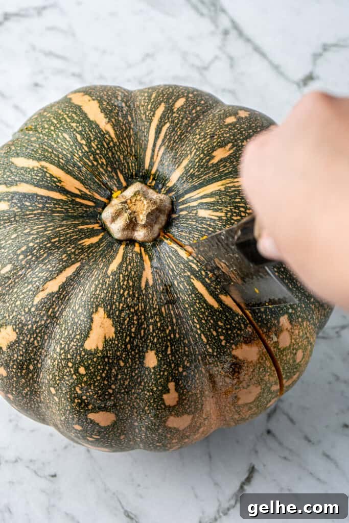 How to Make Smooth Homemade Pumpkin Puree for Baking 4 A knife cutting the pumpkin.
