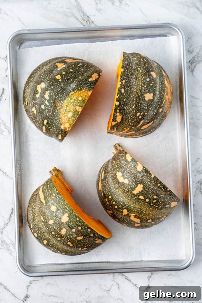 How to Make Smooth Homemade Pumpkin Puree for Baking 7 Pumpkin quarters on a baking tray.