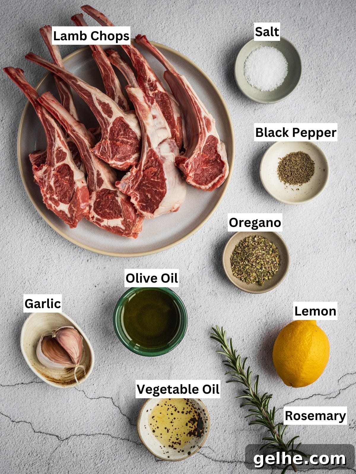 Greek lamb chops recipe ingredients with individual labels on a board.