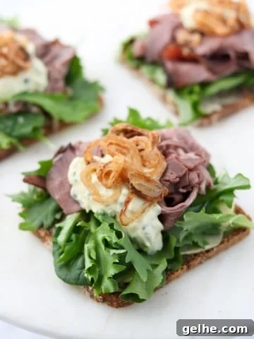 A open roast beef sandwich on a plate