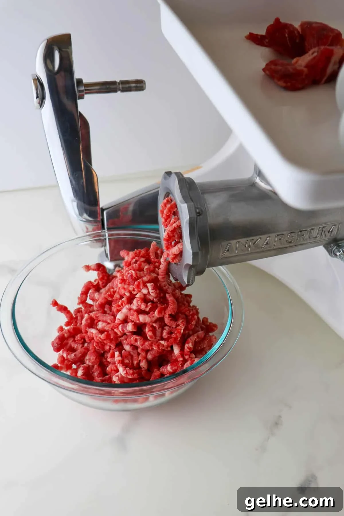 Ankarsrum Mincer attatchment grinding beef.