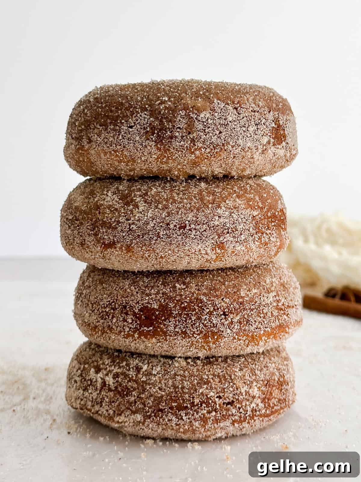 Baked Apple Cider Donuts Recipe | Light Autumn Donut Treat 10 a tall stack of baked apple cider donuts.
