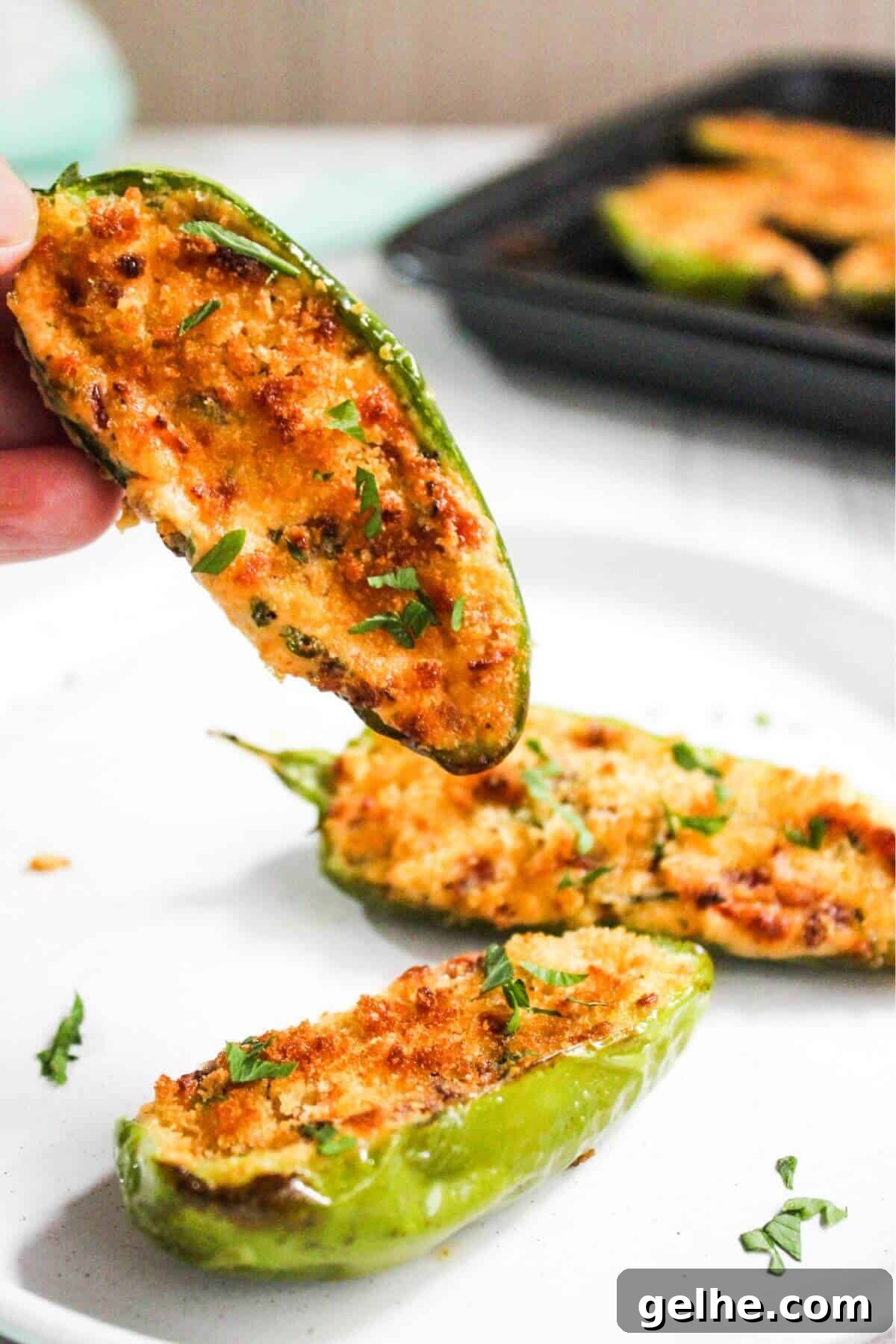 Closeup of jalapeño popper held in hand.
