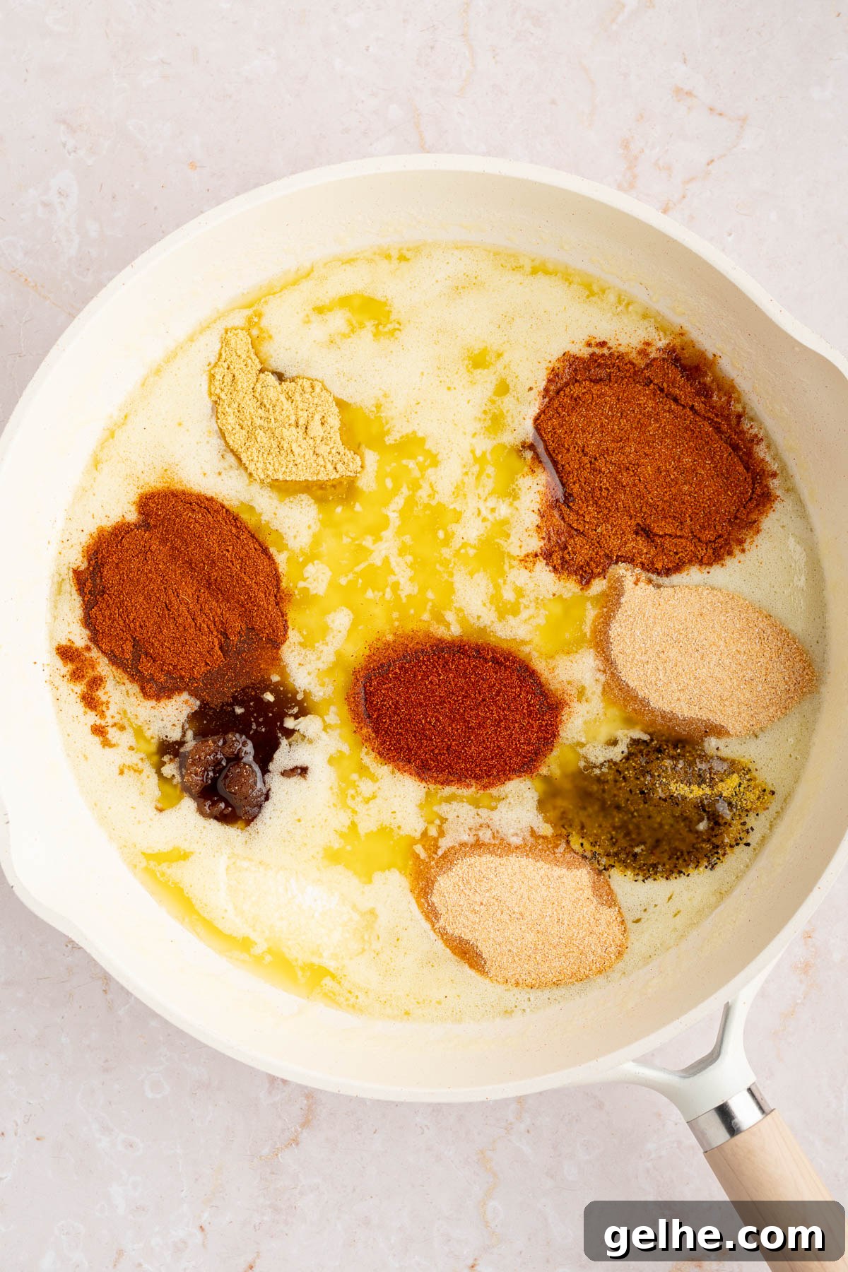 The seasonings for the sauce in the pan before stirring together.