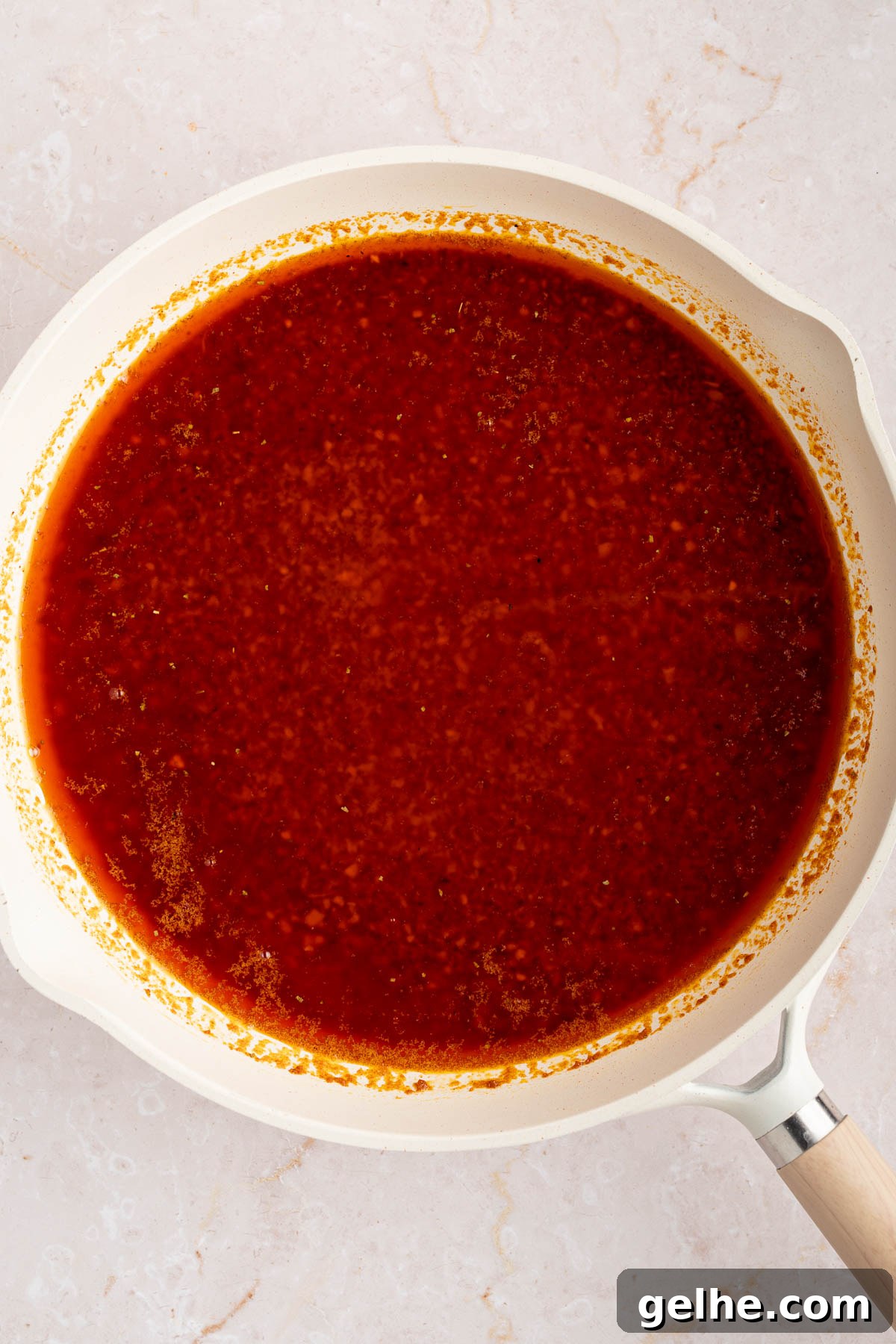 The sauce in the pan after adding the lemon juice and vinegar.