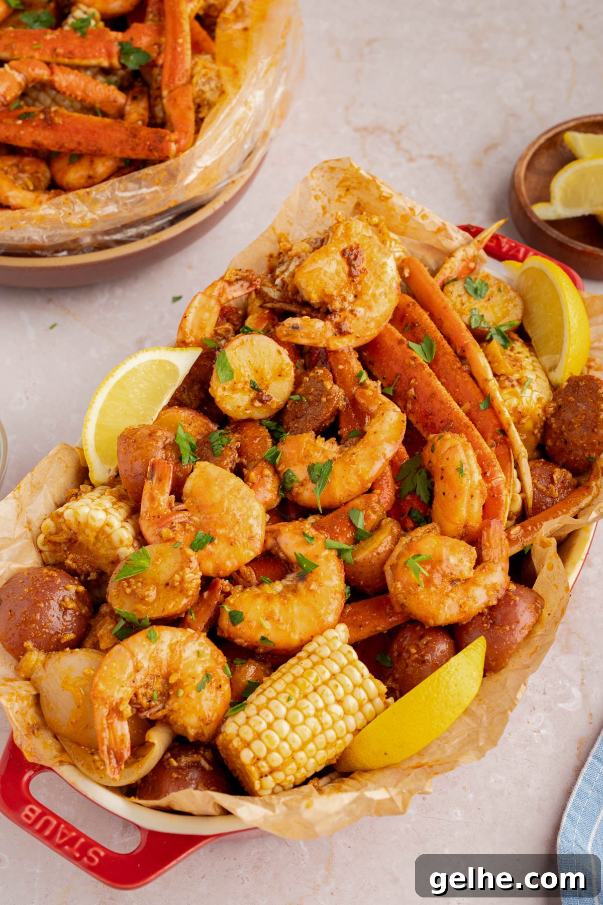 The seafood boil poured into a serving dish lined with paper.