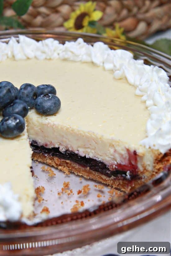 Lemon Blueberry Pie combines a tangy cheesecake layer with sweet blueberries and a buttery crust.