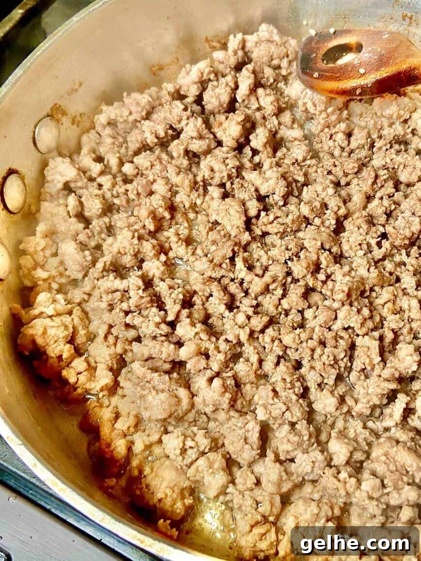 Browning ground pork.