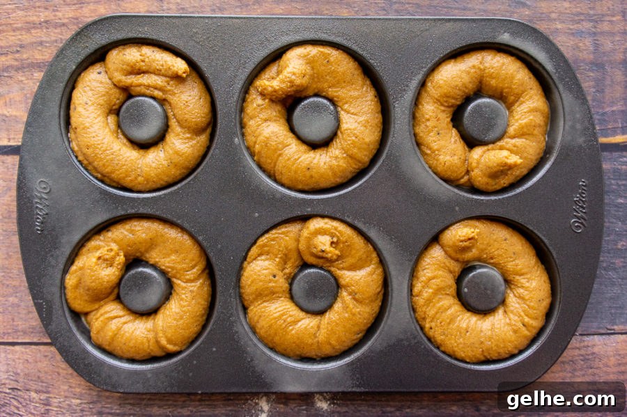 baked pumpkin donut batter in a pan