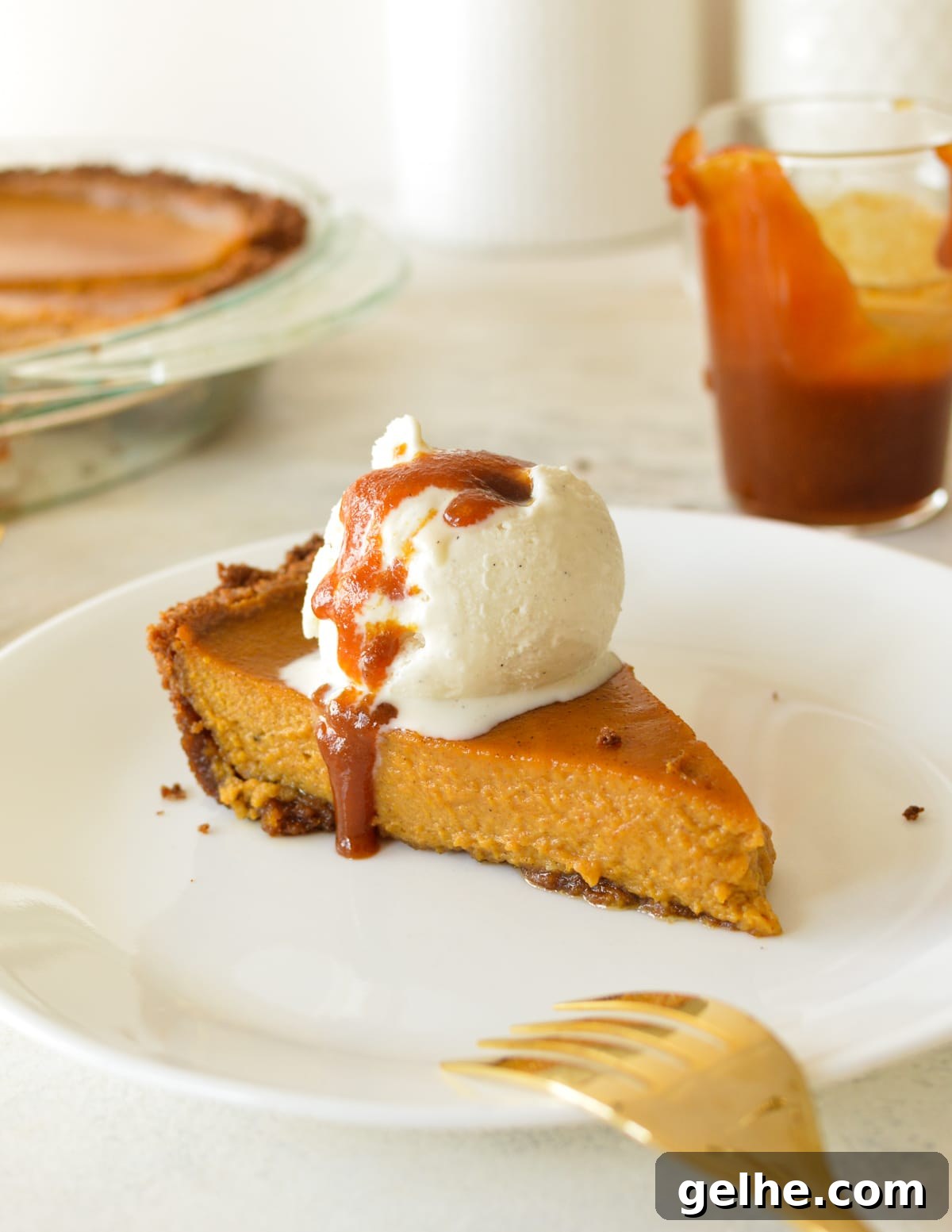 Pumpkin Pie with Crunchy Graham Cracker Crust 2 a slice of pumpkin pie with ice cream and caramel