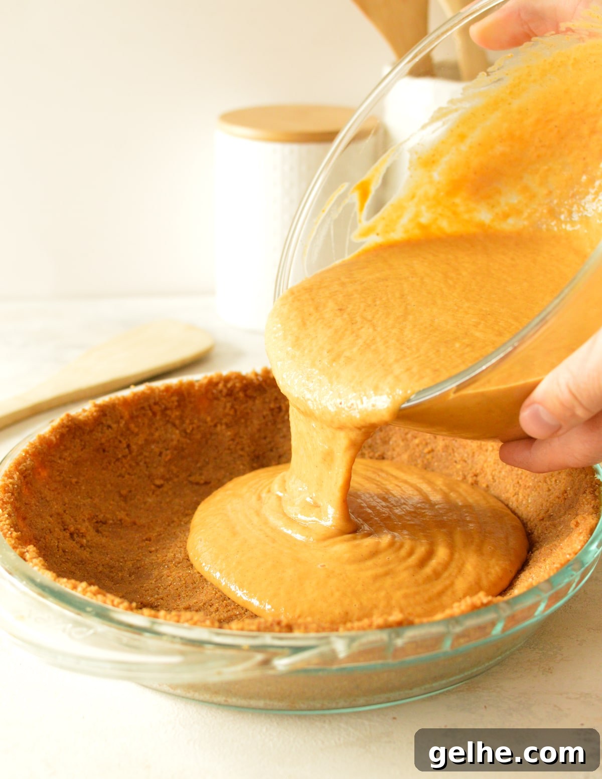 Pumpkin Pie with Crunchy Graham Cracker Crust 7 hands pouring pumpkin pie batter into crust