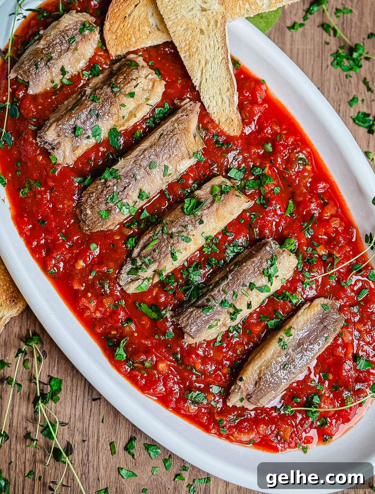 sardines fra diavolo on a white platter