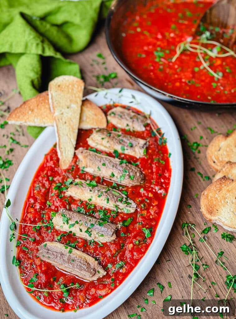 sardines in a spicy red sauce on a platter