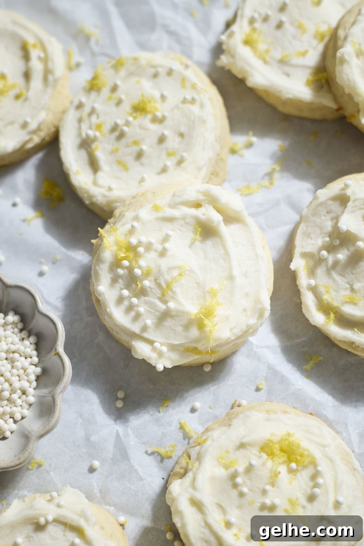 Lemon Sugar Cookies Made with Sourdough Discard 2 Sourdough Discard Lemon Sugar Cookies on white parchment paper.