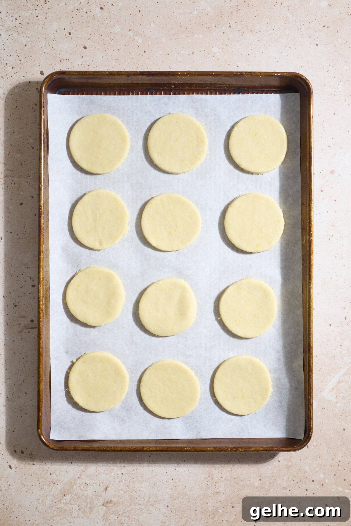 Lemon Sugar Cookies Made with Sourdough Discard 11 Cookies cut into circles and placed on a baking sheet.