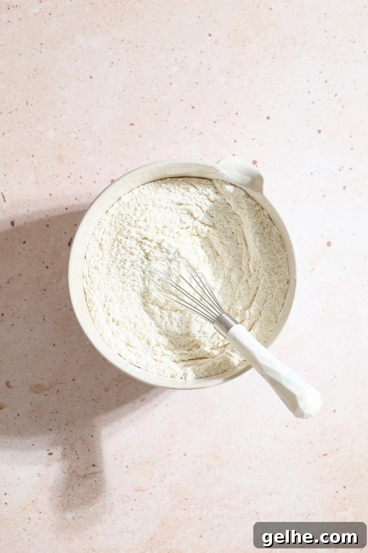 Lemon Sugar Cookies Made with Sourdough Discard 4 Dry ingredients in a mixing bowl with a whisk.
