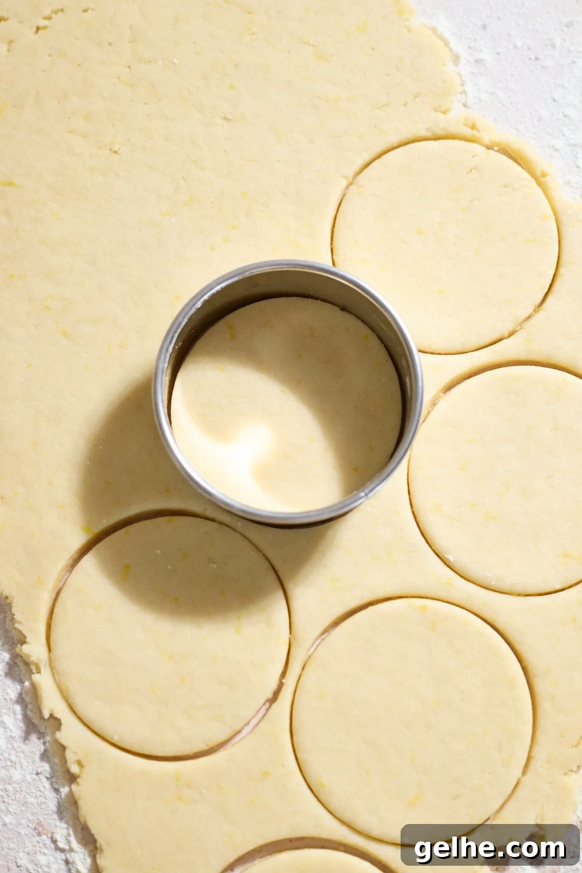 Lemon Sugar Cookies Made with Sourdough Discard 10 Cookie cutter pressing into the dough.
