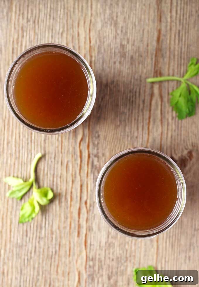 Rich Slow Cooker Beef Bone Broth Recipe for Deep Flavor 4 Slow Cooker Beef Bone Broth ready to sip or use in recipes.