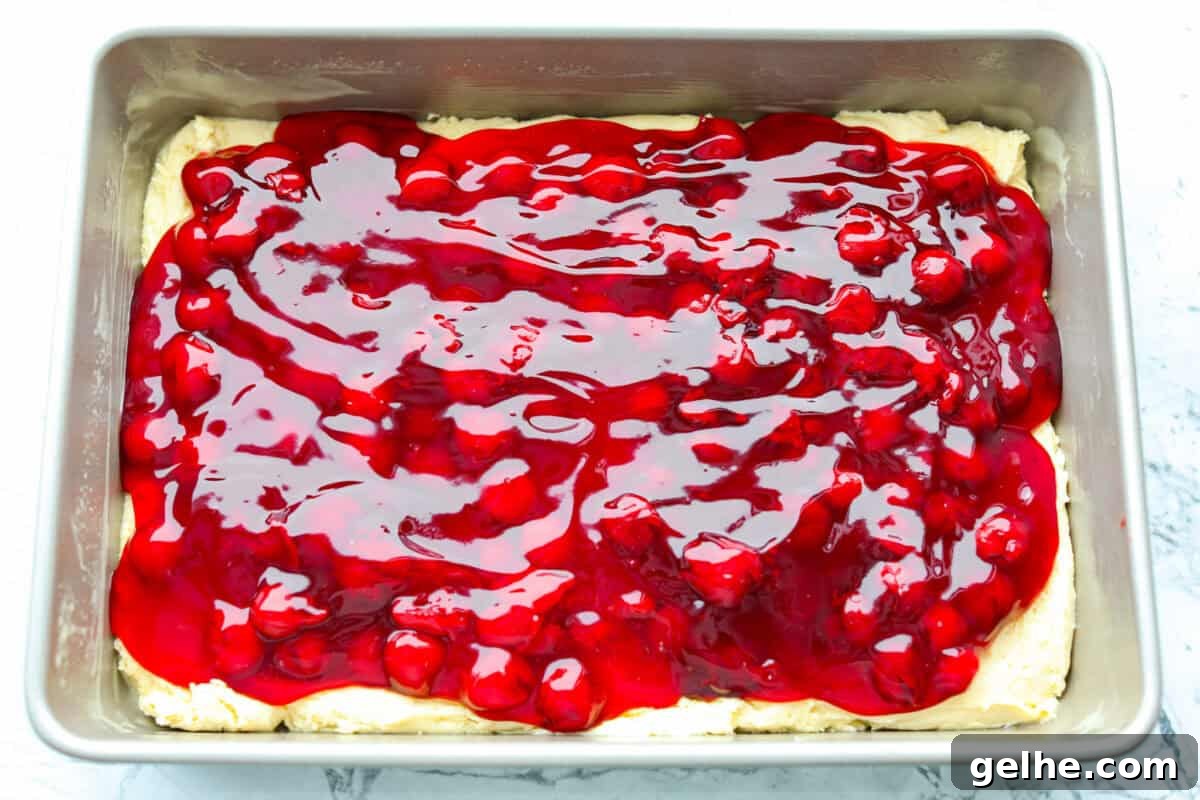 Cherry pie filling added to the top of the batter.