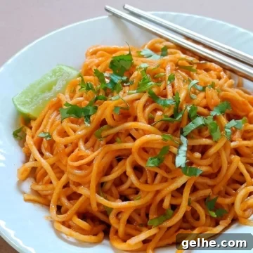 Gochujang buttered noodles served on a white plate.