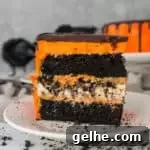 Recipe for black velvet cookies ’n cream cheesecake cake--full of chocolate and Halloween spirit! Perfect #Halloween party food!