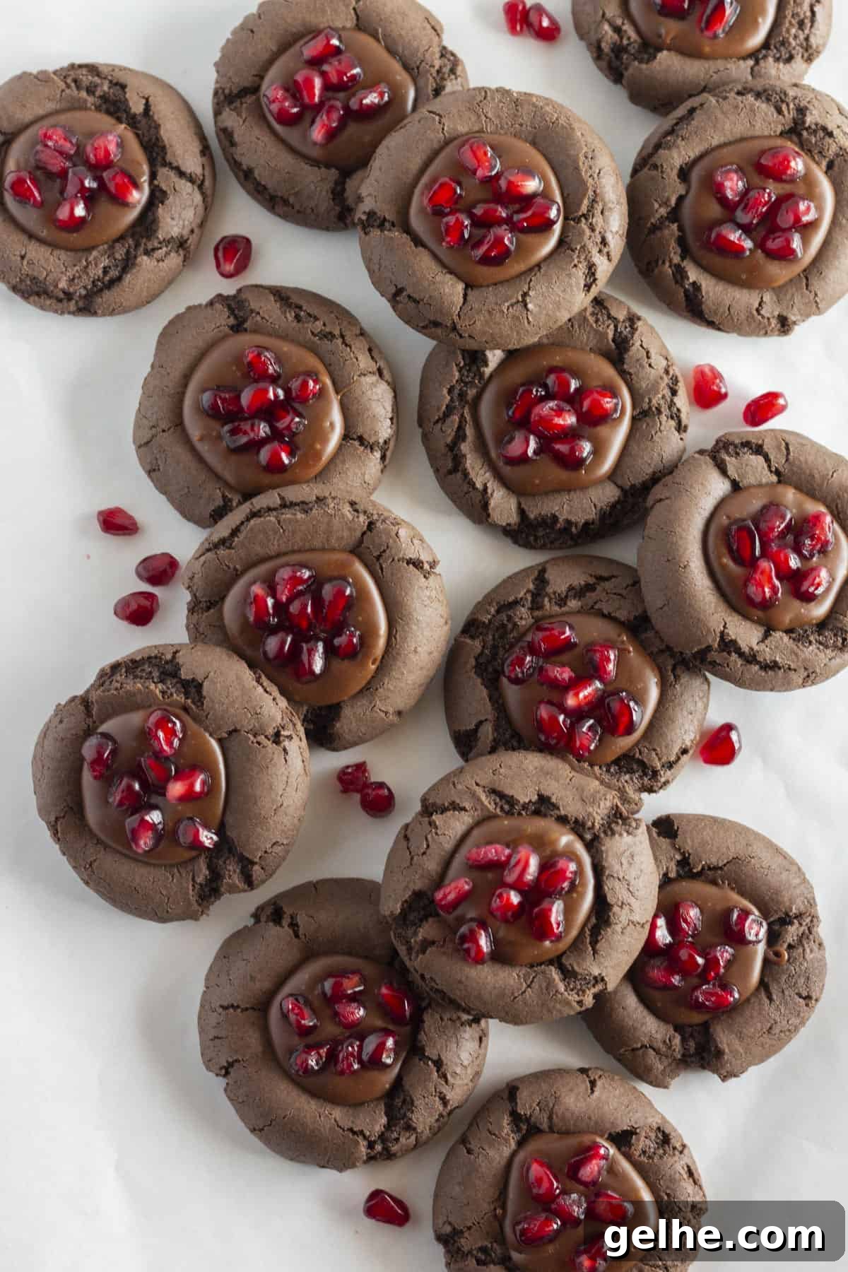 Looking down on a dozen chocolate pomegranate cookies.