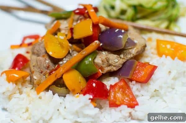 North Carolina Pork & Five Pepper Stir-Fry from Life of a Ginger served over white rice.