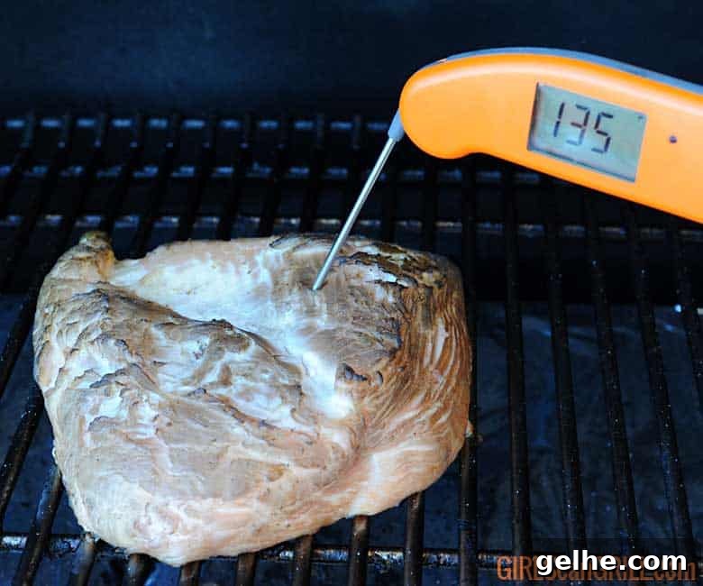 Cranberry Barbecue Turkey Burnt Ends Recipe 6 smoked turkey breast on grill with thermometer showing 135F.