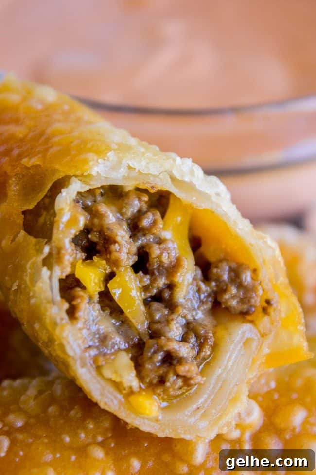cheeseburger egg rolls in a pile.