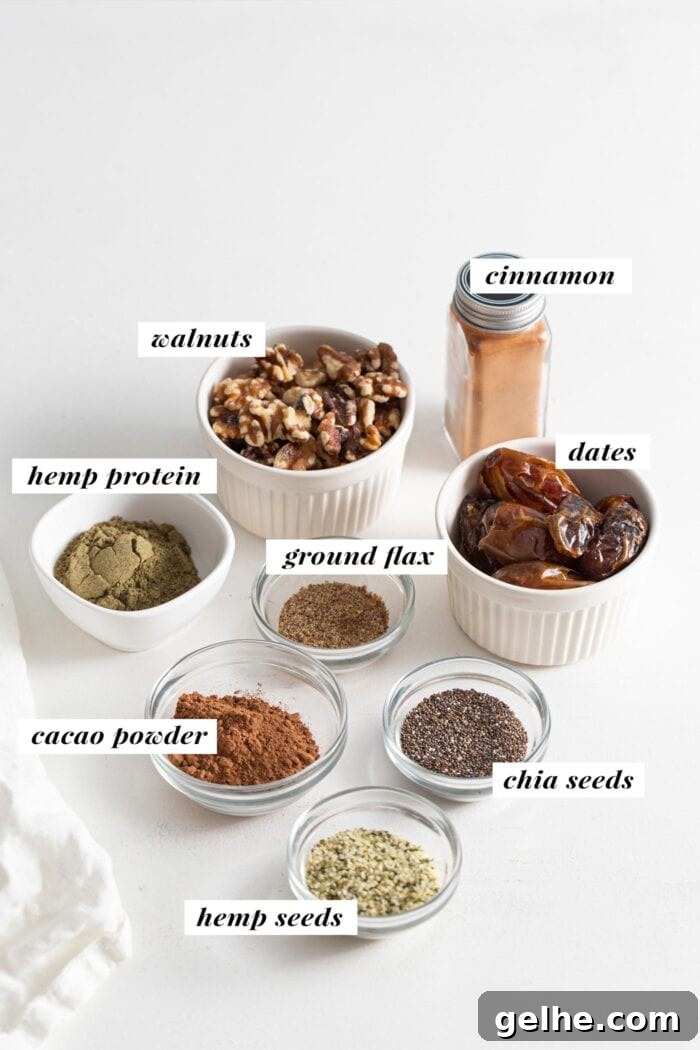 Dates, walnuts, cocoa powder, cinnamon, hemp seeds, protein powder, ground flax and chia seeds in small glass bowls, each ingredient labelled is with text overlay.