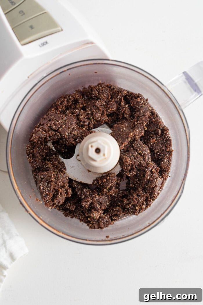 Chocolate energy ball dough in a food processor.