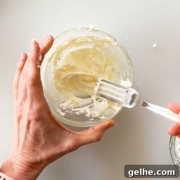 Stirring the cream cheese frosting.
