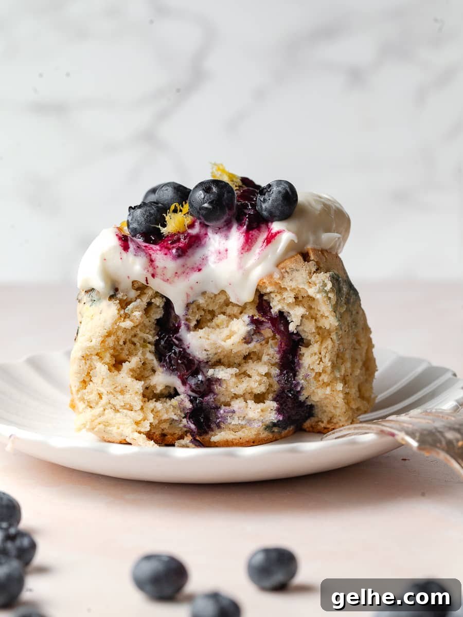 Gluten-Free Blueberry Sweet Rolls Recipe for Soft, Fluffy Buns 9 gluten free blueberry cinnamon rolls topped with lemon cream cheese frosting and fresh blueberries and lemon zest, blueberry sweet rolls