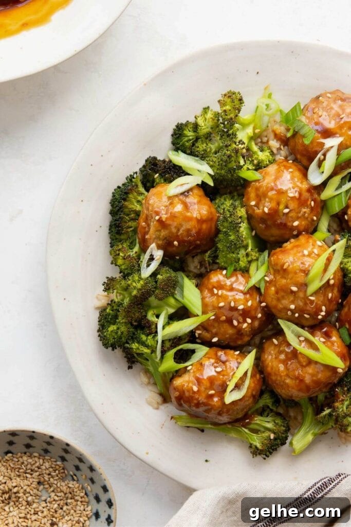teriyaki turkey meatballs on a plate with crispy broccoli and brown rice