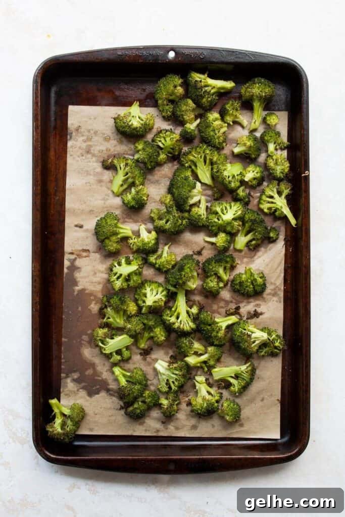 crispy broccoli on a baking sheet after roasting