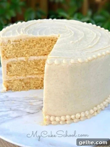 Easy Banana Cake, sliced, on a cake pedestal.