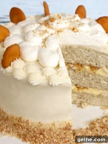Sliced Banana Pudding Cake on a cake pedestal.