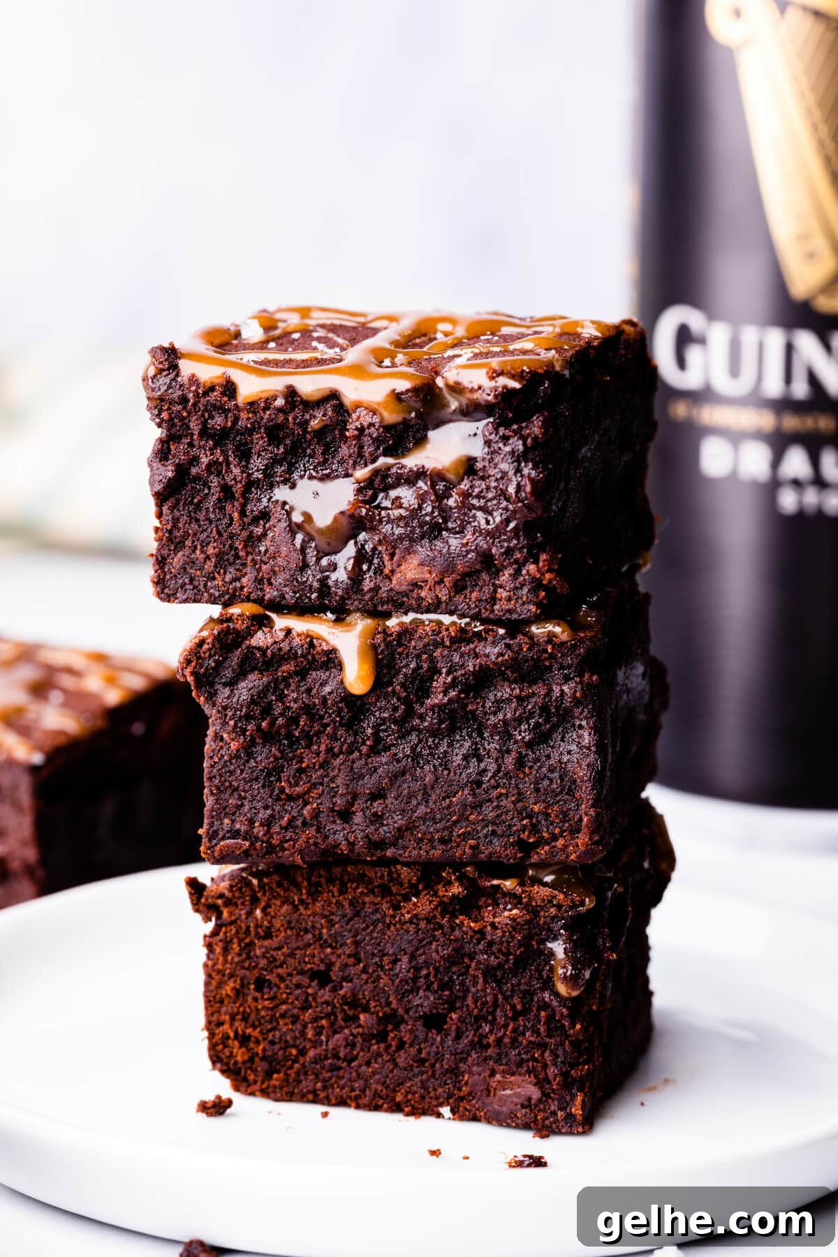Guinness Chocolate Brownies with Rich Stout Flavor 2 stack of 3 Guinness brownies on a small white plate.