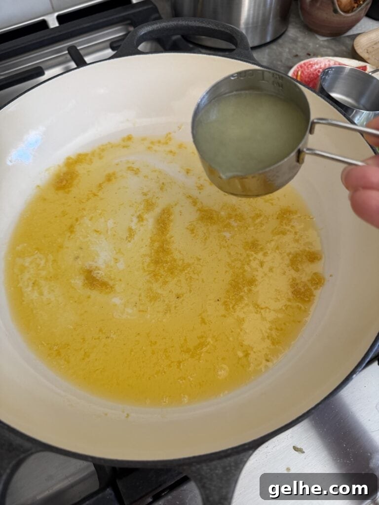 Adding freshly squeezed lemon juice to pan with zest and butter.