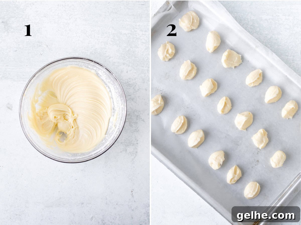 Bowl of cheesecake filling and cream cheese dollops on lined cookie sheet