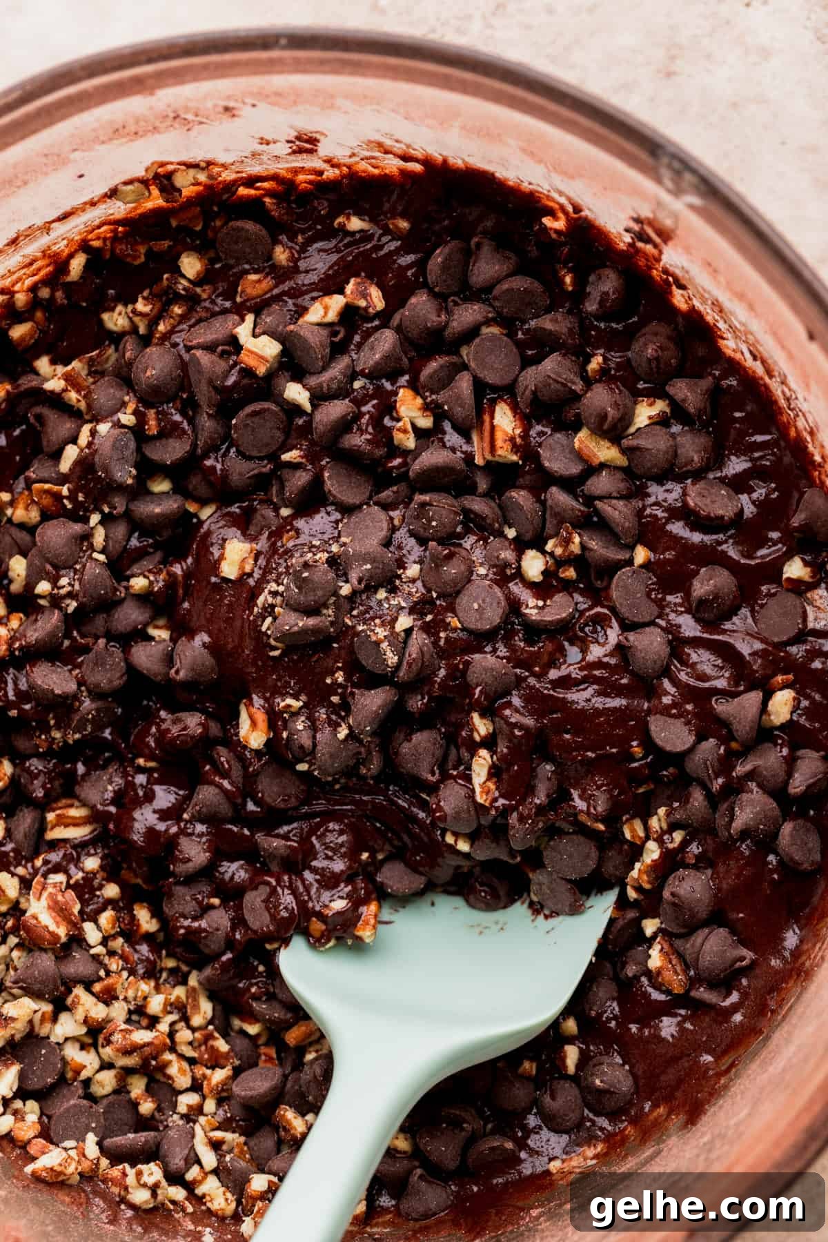 Pecans on top of brownie batter.