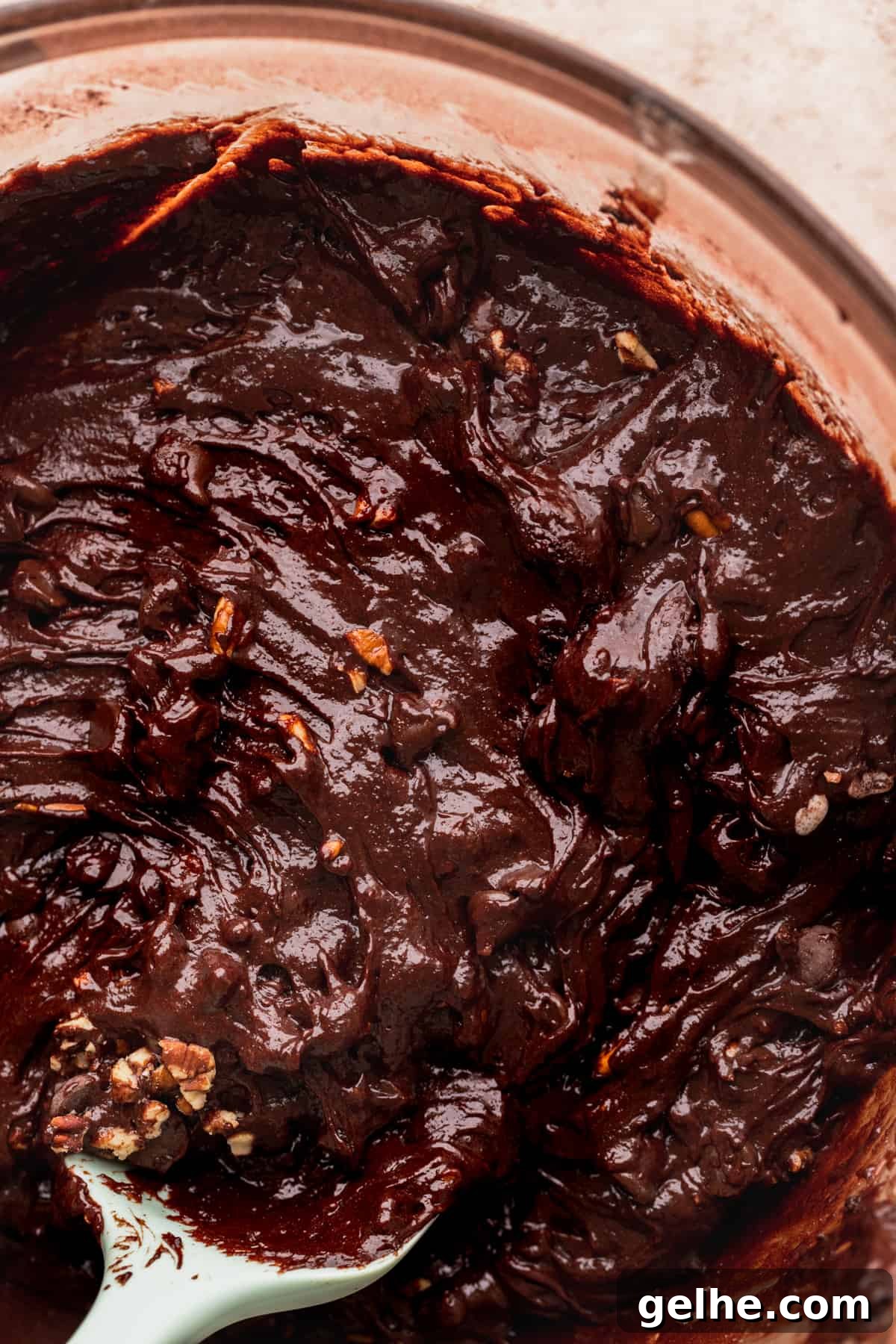 Brownie batter in a glass bowl.